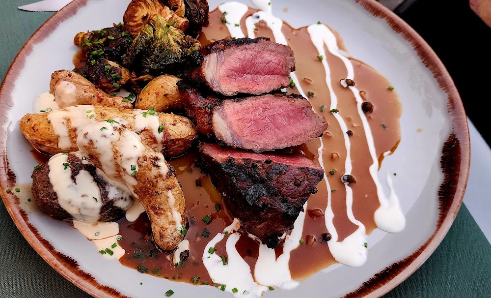 Log Haven signature dishes Grilled Bison Steak, Grilled Elk Steak, Blue Corn Dusted Prawns, Filet Mignon.